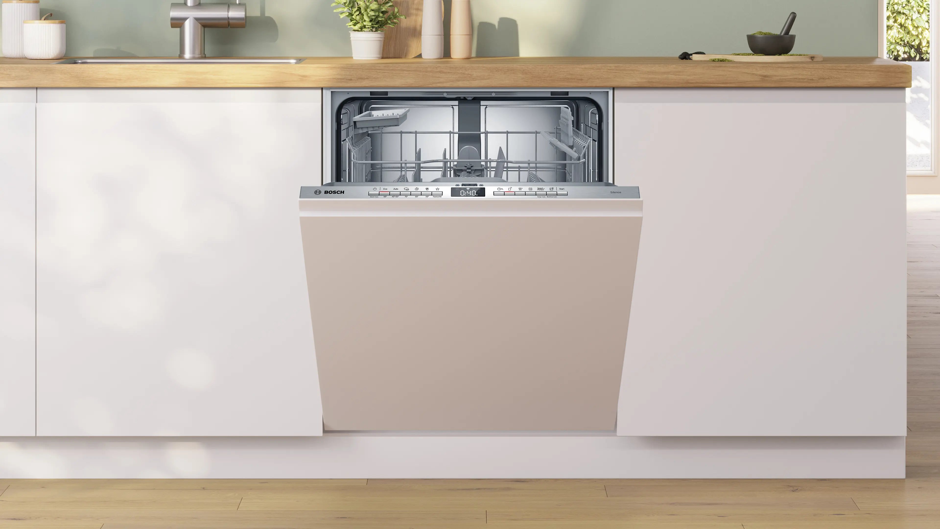 Bosch SBV4HTX03E Serie 4 fuldt integrerbar opvaskemaskine placeret i køkkenet med det flotte kontrolpanel