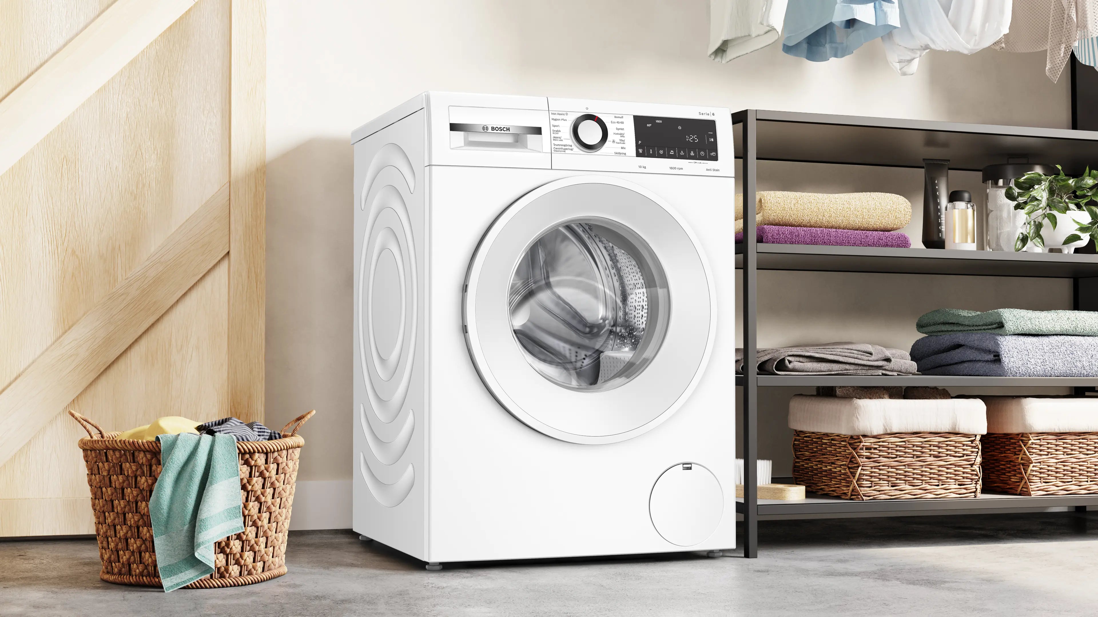 Den unikke designet Bosch WGG256ZZSN vaskemaskine – 10 kg placeret i vaskerummet