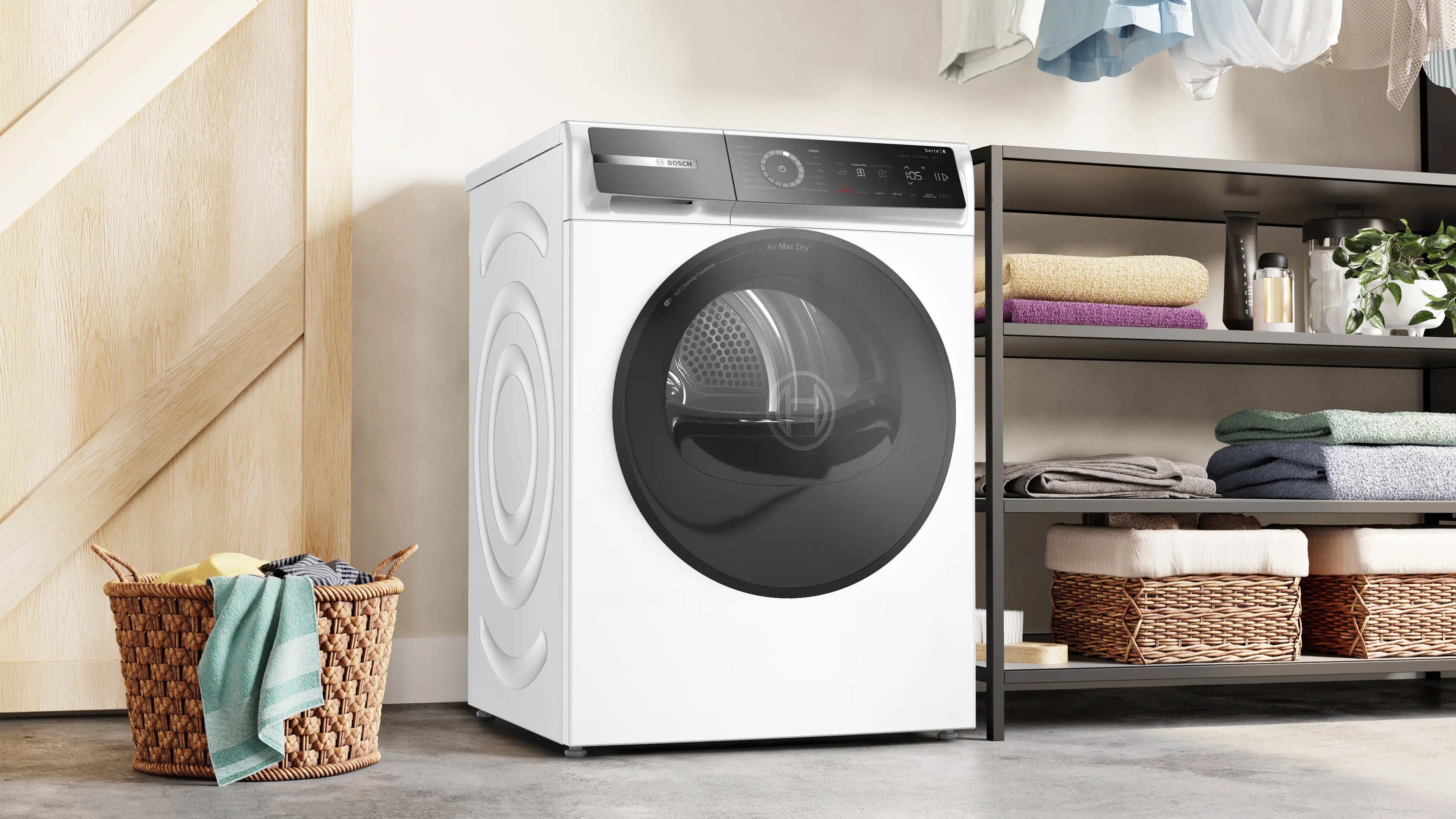 Den æstetiske Bosch WRB247D0SN tørretumbler med varmepumpe 9 kg placeret i vaskerummet