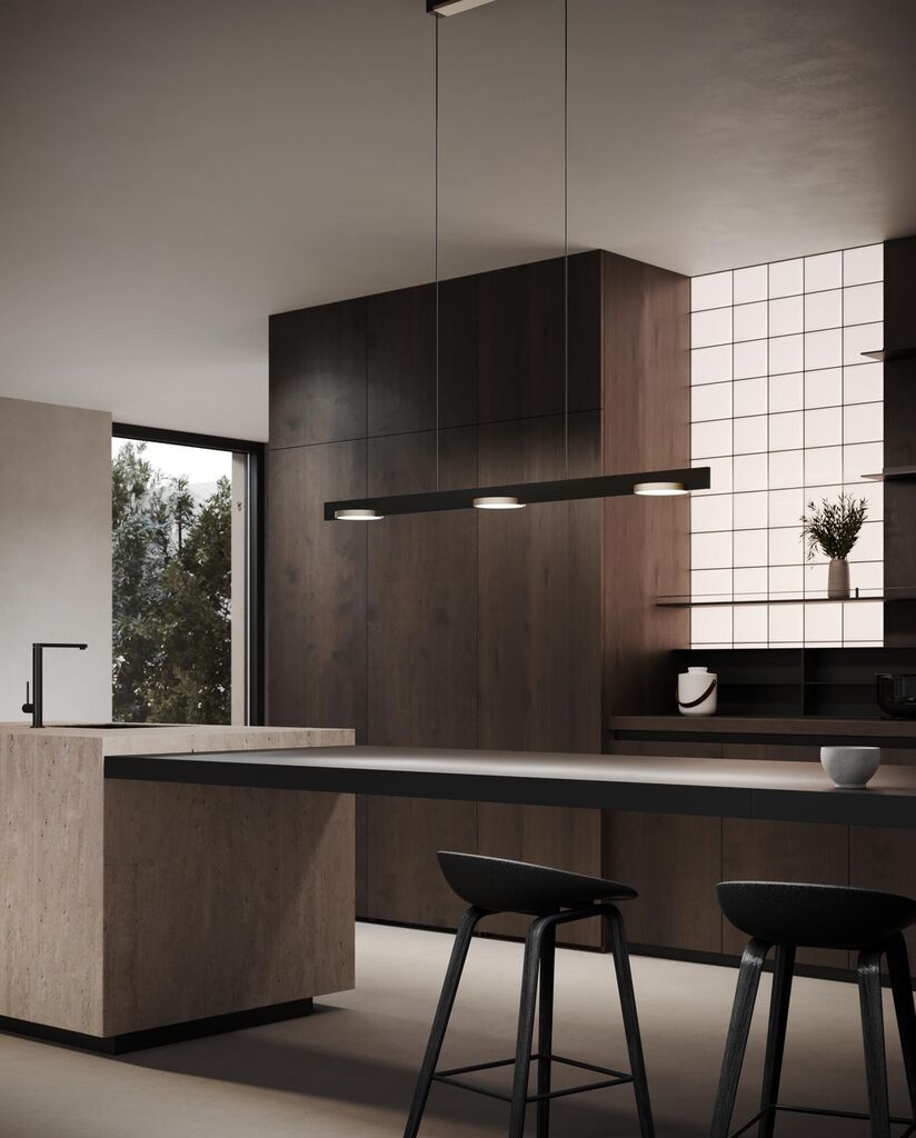 Den elegante designet Inlay S1250 Linear Disc SwitchTune 2700-3000K i Mat Sort/Satin Guld hængt op i køkkenet for dens behagelige belysning