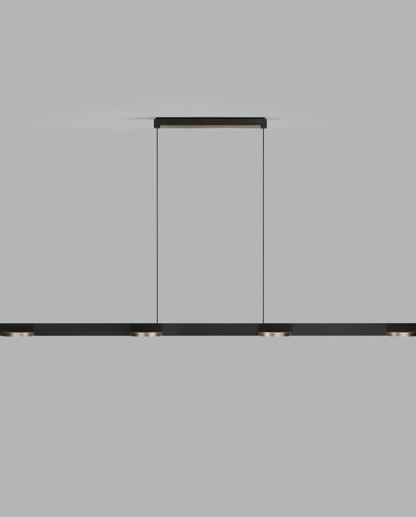 Zoomet helt ind på den unikke designet Inlay S1800 Linear Disc SwitchTune 2700-3000K i Mat Sort/Satin Guld hængt op foran en væg for en flot kontrast